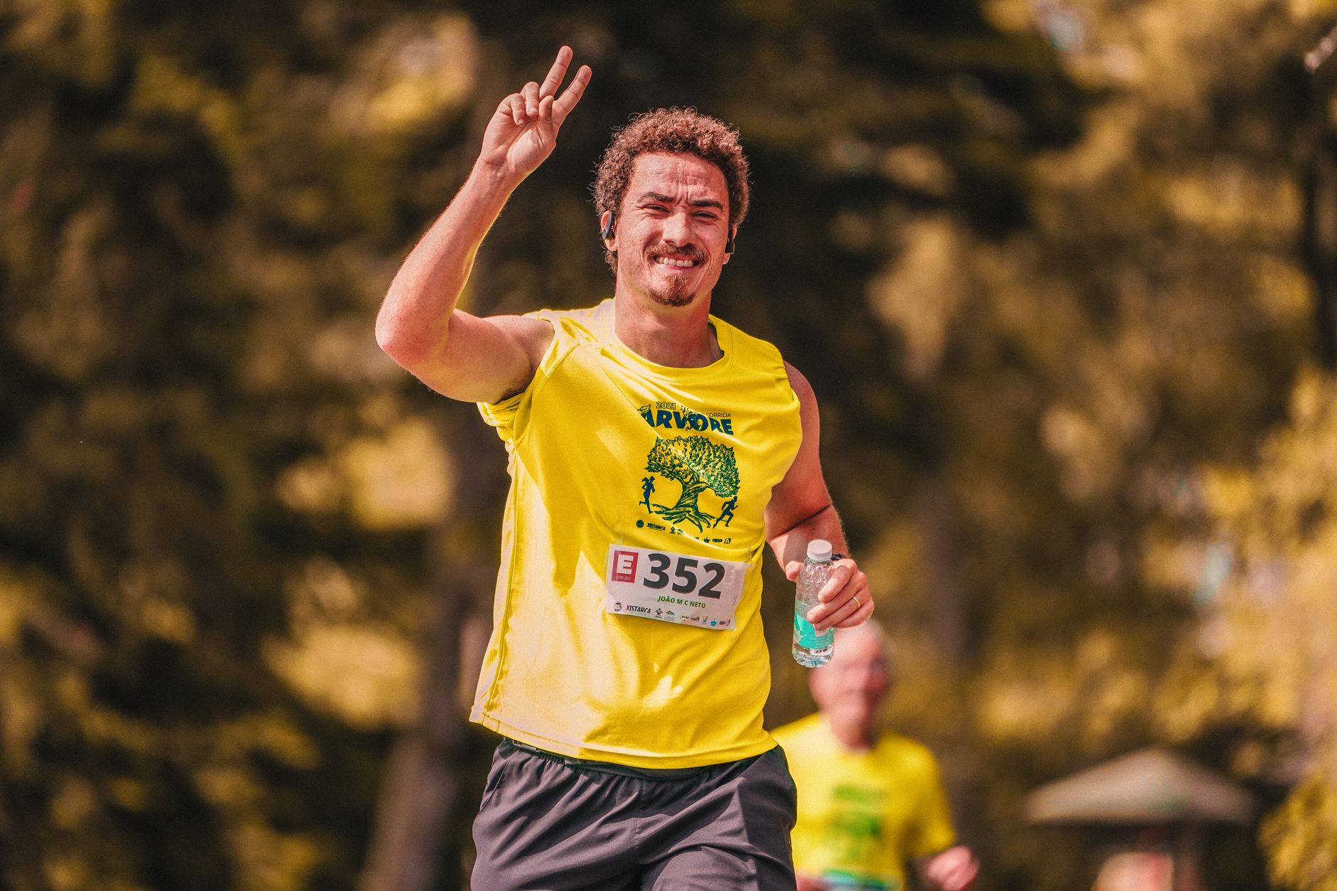 Participants in a rural community event charity fun run through English countryside lanes